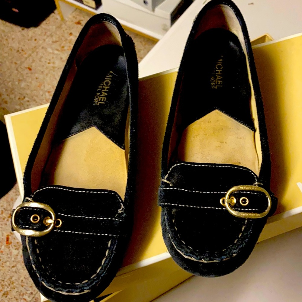 Black suede loafer with gold buckle